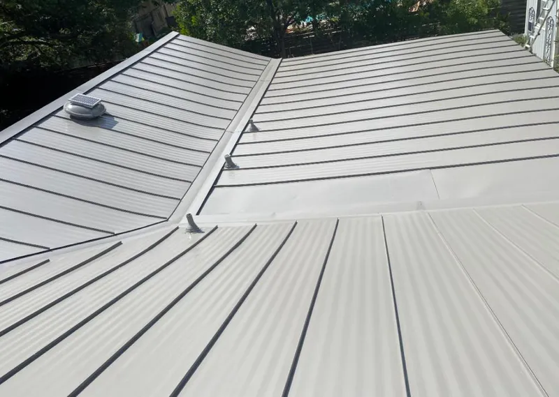 Solar attic fan installed on a metal roof for Roof Ventilation in Bithlo
